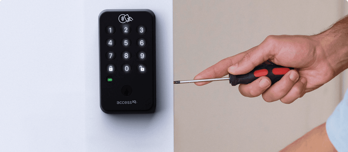 Man installing AccessIQ deadbolt